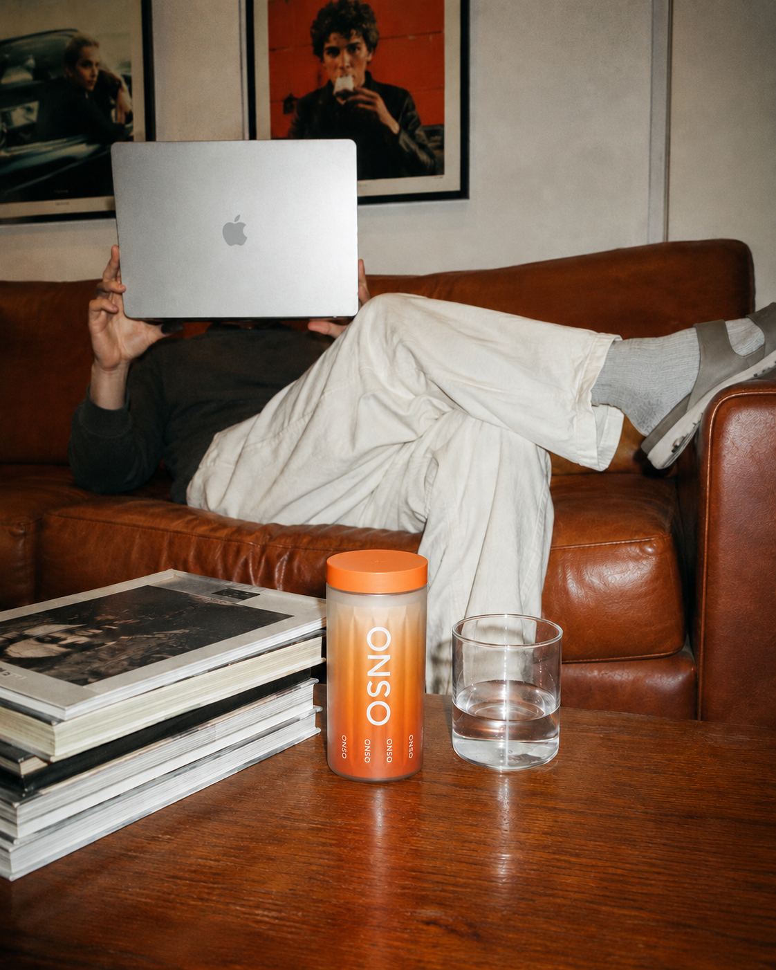 ONSO container on a coffee table beside a glass of water